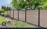 a fence is being built in a backyard